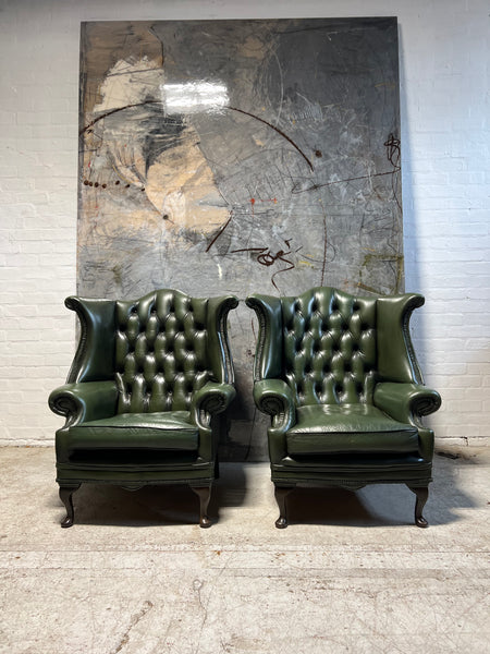 A Very Smart Pair of Racing Green Wing Back Chairs with Ottoman