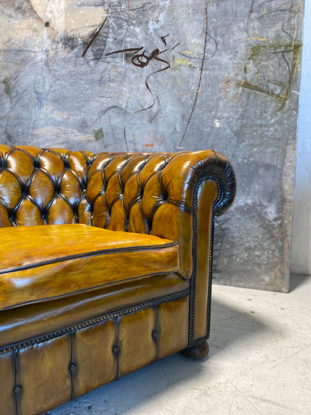 An amazing Matching Pair of Golden Tan MidC Chesterfield Club Chairs