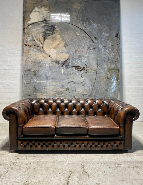 A Lovely Matching Pair of Brown Leather Chesterfield Sofas