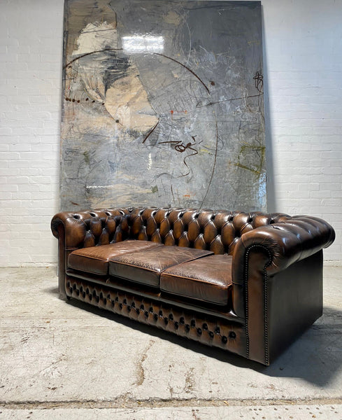 A Lovely Matching Pair of Brown Leather Chesterfield Sofas