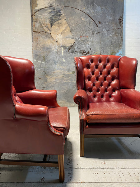 A Very Good Matching Pair of MidC Gentleman’s Wing Chairs in Raspberry Leather