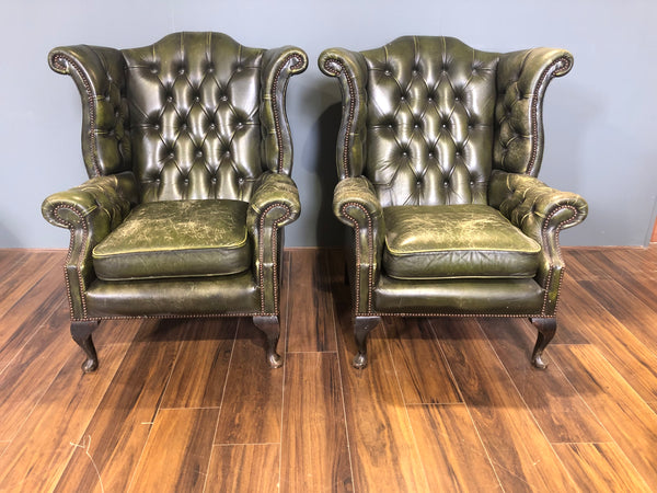A Character-full Matching Pair of Rich Green Wing Back Chesterfield Chairs