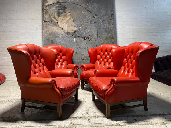 Priced Individually - A Striking Collection of Four Chesterfield Wing Back Chairs in Pillar Box Red