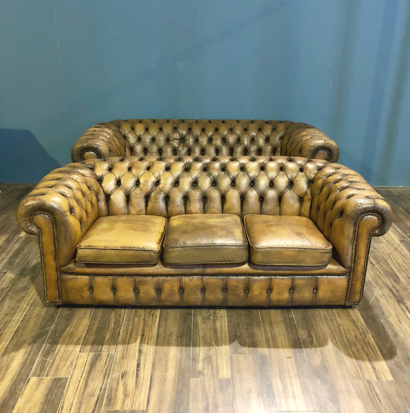 A Very Very Cool Matching Pair of Vintage Leather Chesterfield Sofas in a rustic Golden Tan
