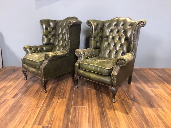 A Character-full Matching Pair of Rich Green Wing Back Chesterfield Chairs