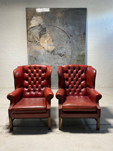 A Very Good Matching Pair of MidC Gentleman’s Wing Chairs in Raspberry Leather